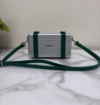 CHRISTIAN CROSS-BODY CLUTCH (GREEN STRAP)