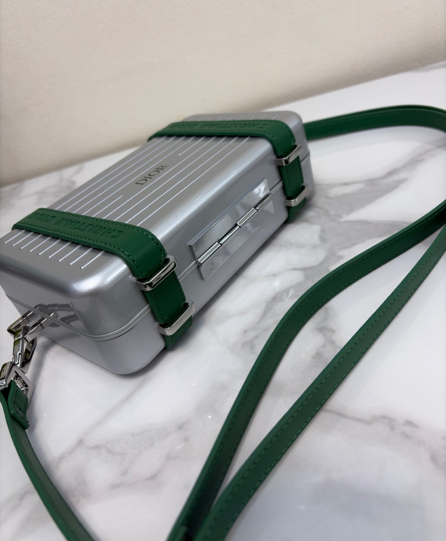 CHRISTIAN CROSS-BODY CLUTCH (GREEN STRAP)