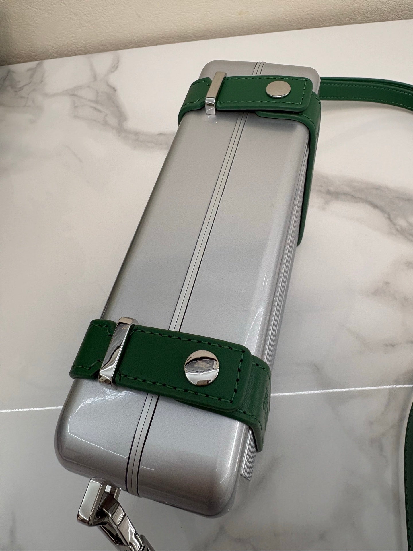 CHRISTIAN CROSS-BODY CLUTCH (GREEN STRAP)