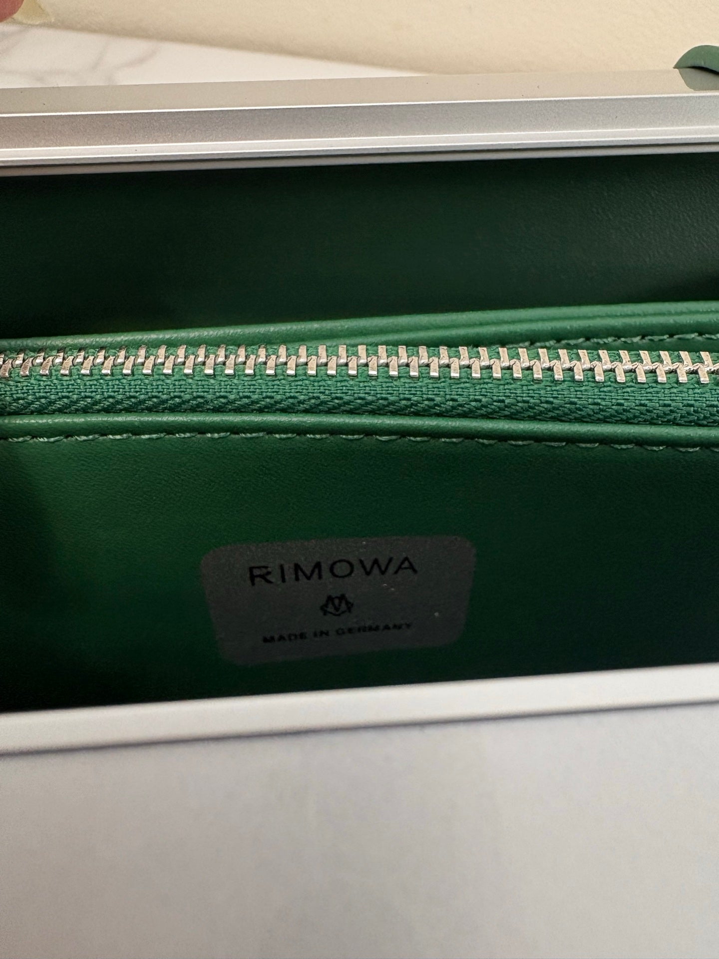 CHRISTIAN CROSS-BODY CLUTCH (GREEN STRAP)