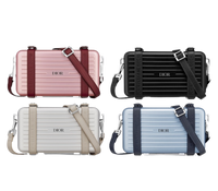 CHRISTIAN CROSS-BODY CLUTCH